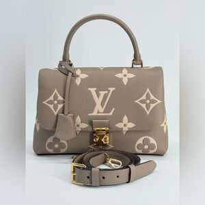 Louis Vuitton Madeleine Handbag
Monogram Empreinte Giant MM Too
Handle Bag